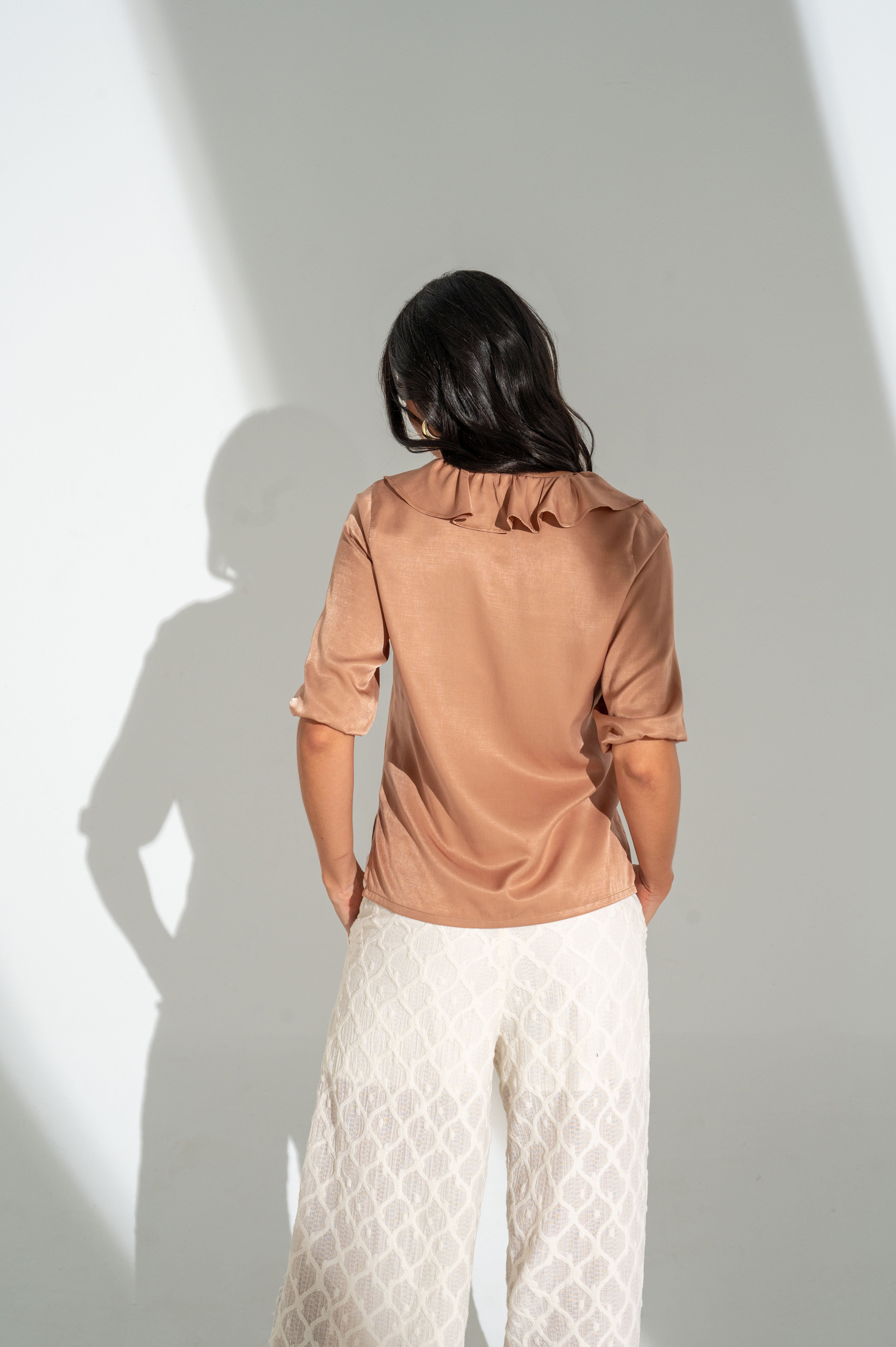 Blusa manga 3/4 elástico en puños.